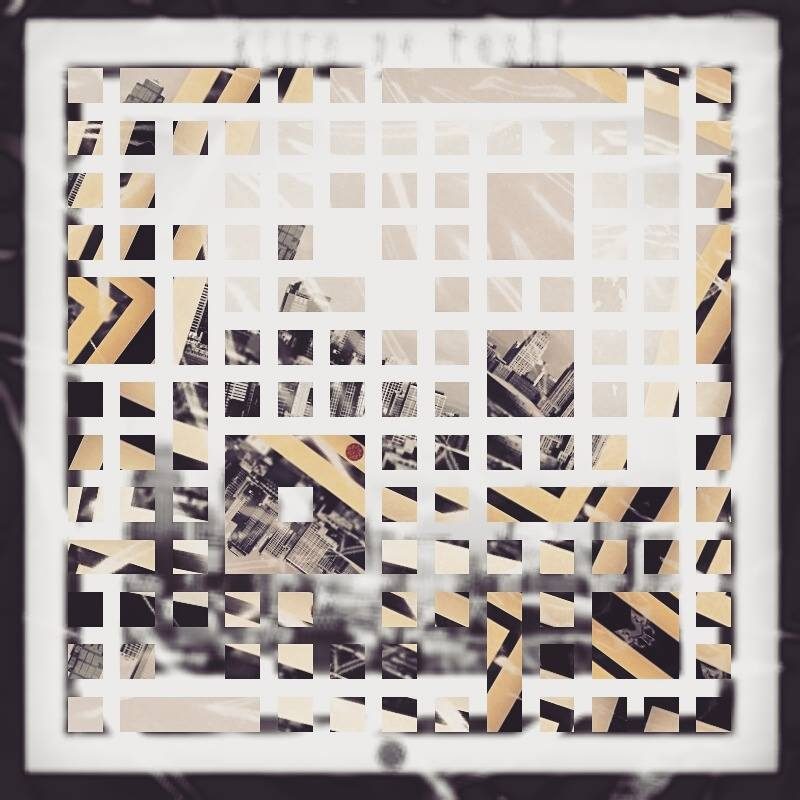 A white grid cut over a black-and-white city photo